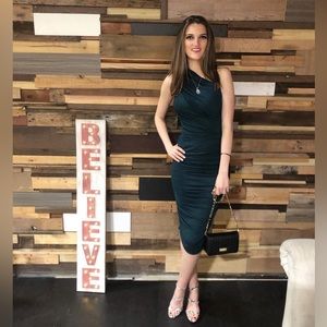 Beautiful dark green. Can be worn long or lifted to make it short.